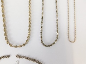 A group of silver chains, to include a modern wave design silver chain, 60cm long a multi-link twist design chain, 44cm long, a Figaro type chain, 44cm long and two curb lined chains, 40cm long and 44cm long, together with a silver identity bracelet for F - 3