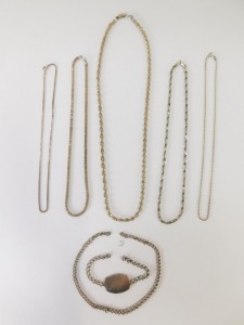 A group of silver chains, to include a modern wave design silver chain, 60cm long a multi-link twist design chain, 44cm long, a Figaro type chain, 44cm long and two curb lined chains, 40cm long and 44cm long, together with a silver identity bracelet for F - 5