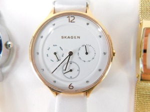 A group of lady's wristwatches, to include a Skagen chronograph on white leather strap, a Skagen stainless and red material strapped bracelet, a Skagen gold plated and mother of pearl dial wristwatch, an Aurora lady's wristwatch and a Paulo Fude wristwatc - 3