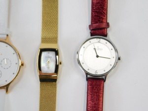A group of lady's wristwatches, to include a Skagen chronograph on white leather strap, a Skagen stainless and red material strapped bracelet, a Skagen gold plated and mother of pearl dial wristwatch, an Aurora lady's wristwatch and a Paulo Fude wristwatc - 4