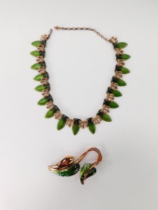 Two items of Matisse enamel jewellery, comprising a brass and green enamel leaf graduated necklace, 36cm long, and a two strand leaf brooch, 8cm high. (2) - 2