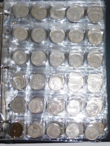 Four albums of UK coinage, comprising six pence pieces, shillings, 2p's, Elizabeth II and George V thru'penny bits, farthings, half pennies, pennies, half crowns, in presentation folders. (4 albums) - 2