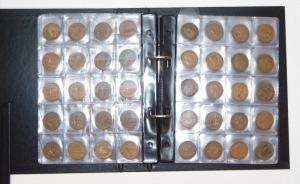Four albums of UK coinage, comprising six pence pieces, shillings, 2p's, Elizabeth II and George V thru'penny bits, farthings, half pennies, pennies, half crowns, in presentation folders. (4 albums) - 4