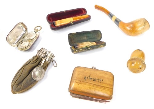 A brass sovereign and half sovereign case, cheroot holders, coquilla nut thimble case, purse, etc.