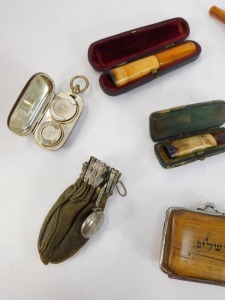 A brass sovereign and half sovereign case, cheroot holders, coquilla nut thimble case, purse, etc. - 2