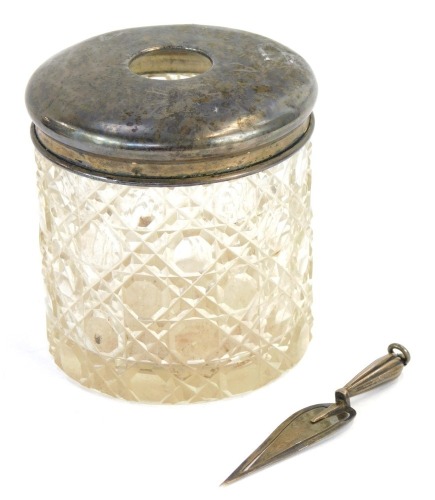 A silver topped dressing table jar and a miniature silver trowel, weighable silver &frac34;oz.