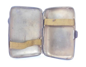 A George V silver cigarette case, with engraved borders and monograms, Birmingham 1917, another similar and a vesta case. (3) - 3