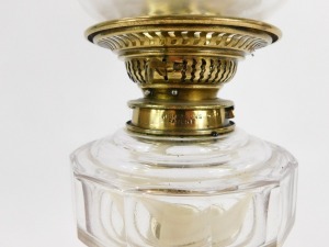 A 19thC brass oil lamp, with an orange and butterfly floral shade, marked Spink and Sons, 38cm high. - 2