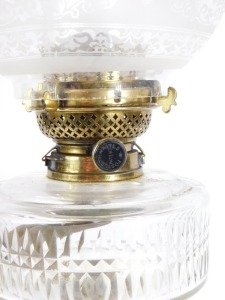 A 19thC brass oil lamp, with glass reservoir, Corinthian column support, with floral glass shade, 55cm high. - 2