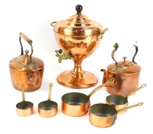 A group of copperwares, comprising a copper samovar, 25cm high, two copper kettles, and a set of five miniature saucepans. (4)