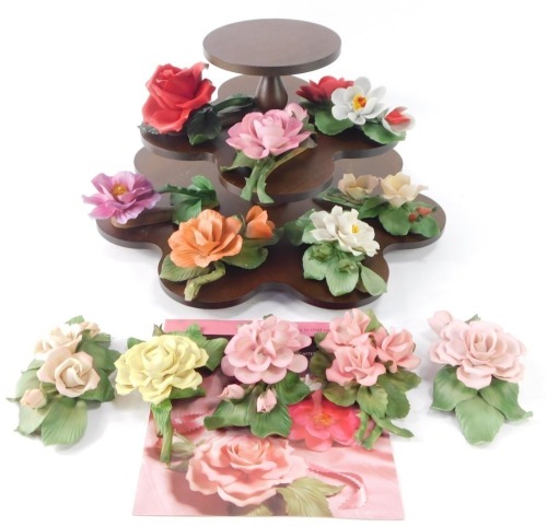 A Capo di Monte floral figure group, on stand, with twelve flowers, each individually boxed.