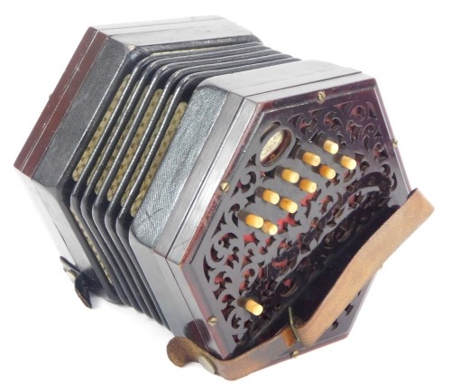 A Lachenal and Co of London concertina, with bone buttons numbered 178270, in a mahogany case, 18cm high.