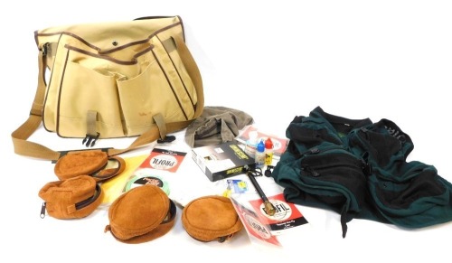 A Daiwa fishing bag, Orbis vest, reel cases, cleaners, etc. (1 bag)