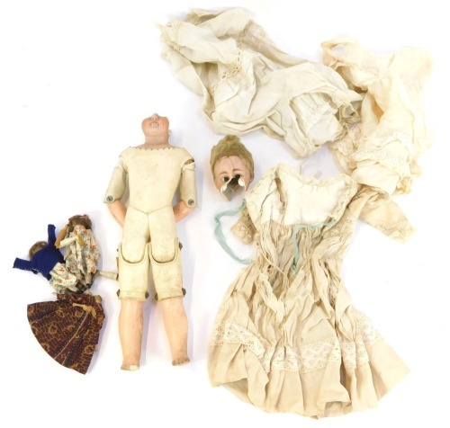A German bisque headed doll, bearing label for Stair & Adams of Newcastle on Tyne, and various doll's clothing, etc. (AF)