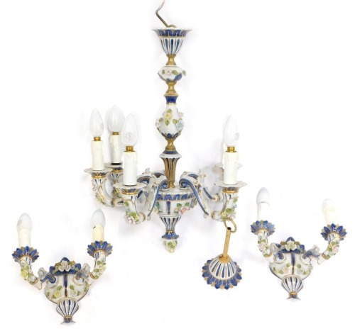 A French porcelain five branch candelabrum, with hanging sconce and two matching wall lights, 47cm high.