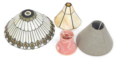 Various light shades, comprising a Tiffany style light shade, 35cm high, a mother of pearl style shade, 20cm wide, and small pink fabric shade and a pair of grey fabric shades. (5)