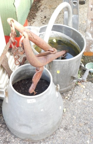 A metal milk churn, converted to a planter, a milk jug and two hames. (4)