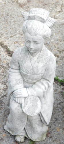 A reconstituted stone figure of a geisha with hand fan, 69cm high.