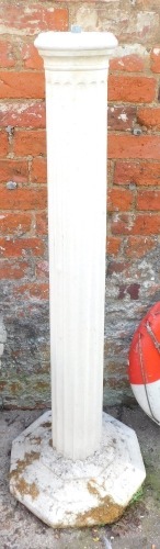 A reconstituted stone column, cream painted on octagonal base, 136cm high.
