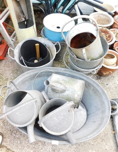 A group of galvanised wares, comprising galvanised tub, four watering cans, six buckets, enamel bin, etc. (a quantity)
