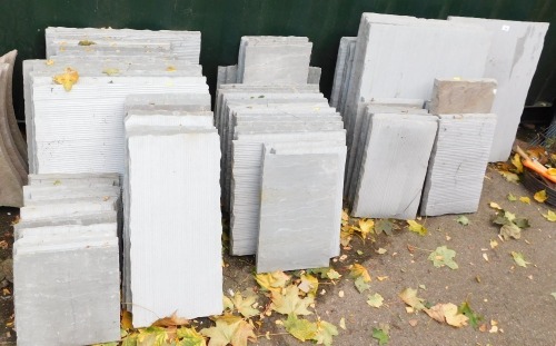 Various sized pieces of grey slate.
