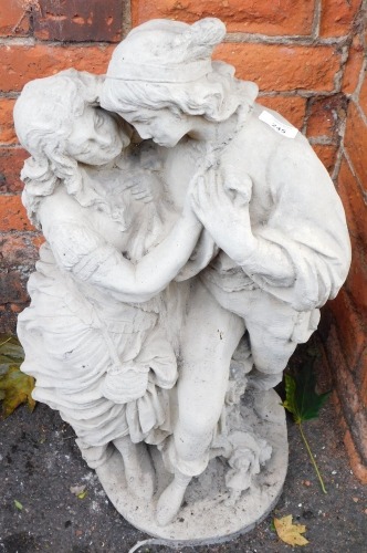 A reconstituted stone figure group of lady and gentleman in embrace, 72cm high.