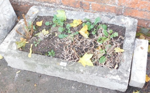 A rectangular stone hewn planter, and feet, 15cm high, 75cm wide, 46cm deep.