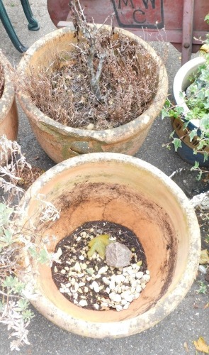 Two terracotta planters, each with lobed top, 46cm diameter. (2)