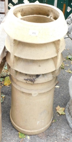 A Victorian chimney pot, with four tiered turreted top, 84cm high, 25cm diameter.