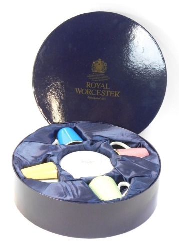 A Royal Worcester coffee can and saucer set, comprising four for The Celebration of Her Royal Highness 80th Birthday 2006, in fitted case.