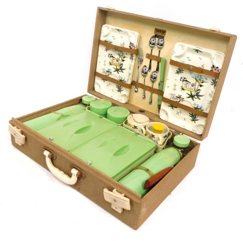 A Brexton picnic set, with fitted interior to include ceramics, printed with exotic islands, etc. (AF)