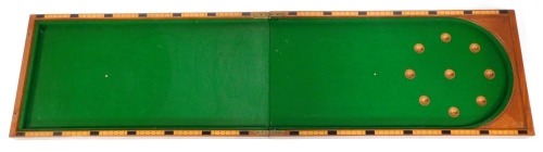 An E P Riley of London Bagatelle mahogany games table, half folding with green velvet lined interior, 109cm high, 56cm wide, 15cm deep.