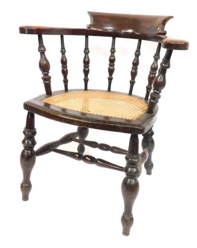 A Victorian smoker's bow chair, with caned seat. (AF)