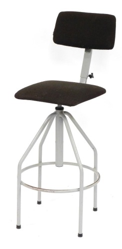 A vintage machinist or workshop swivel chair, with brown upholstery, 104cm high, 43cm diameter. The upholstery in this lot does not comply with the 1988 (Fire & Fire Furnishing) Regulations, unless sold to a known exporter or upholsterer it will be cut f