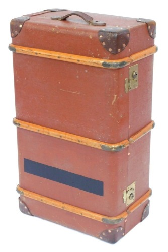 A brown canvas bound trunk, with wooden supports, 30cm high, 84cm wide, 50cm deep.