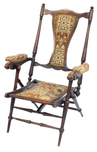An Edwardian mahogany folding steamer chair, with tapestry floral inlays.